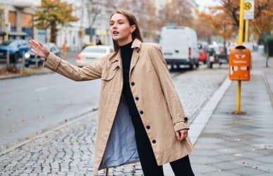 woman watiing for taxi servcie to dia airport in Cherry Creek, CO 